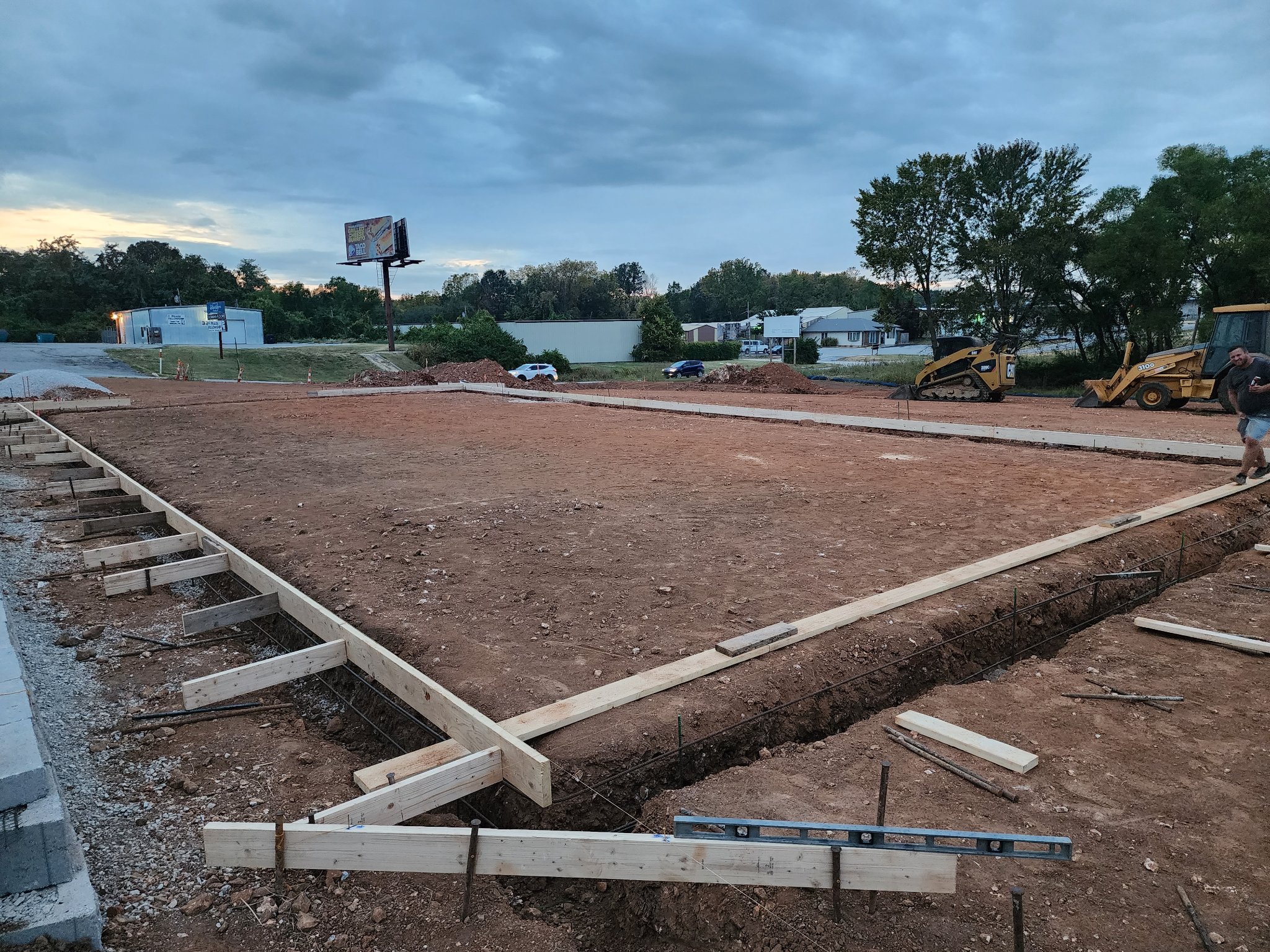 Foundation site preparation at dusk — Right Choice Development Springfield Missouri