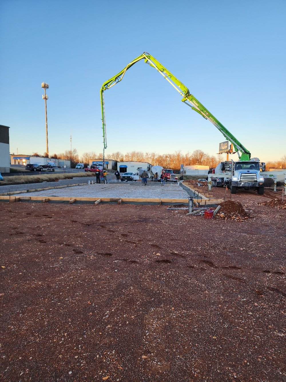 Concrete pump truck pouring foundation for Springfield MO construction project